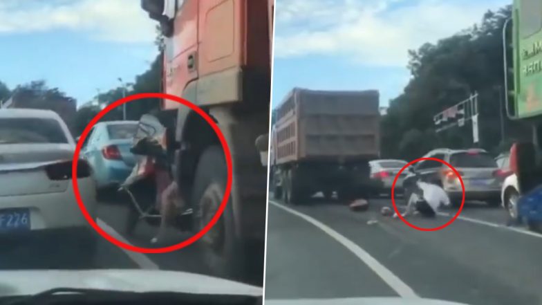 Viral Video: Biker Dodges Death After Coming Under Truck While Crossing Lane on Packed Road