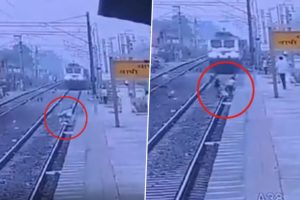 Gujarat: Railway Personnel Risks Life to Save Elderly Man After He Falls and Gets Trapped Between the Tracks, Chilling Video Surfaces