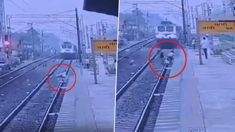 Gujarat: Railway Personnel Risks Life to Save Elderly Man After He Falls and Gets Trapped Between the Tracks, Chilling Video Surfaces